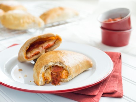 pizza pockets with a bite taken out of them.